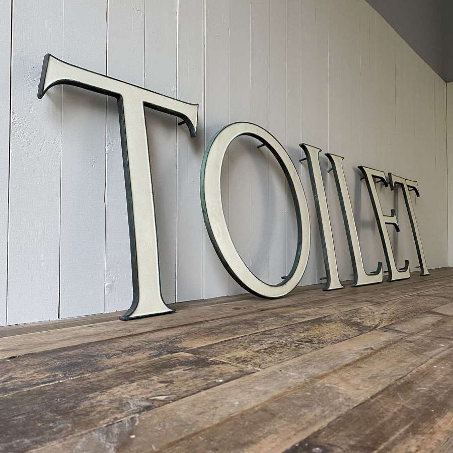 Large enamelled bronze toilet sign
