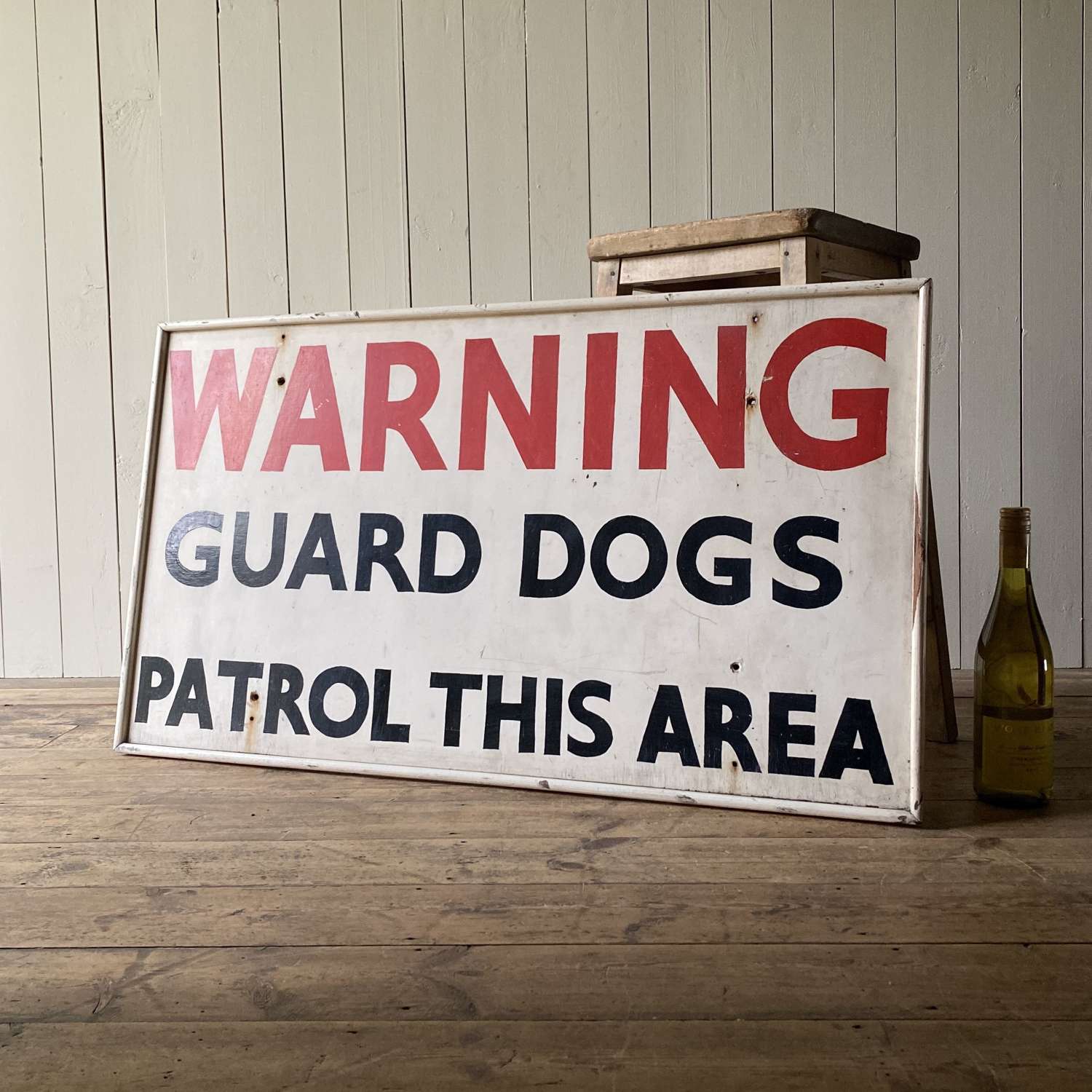 Wooden guard dog sign